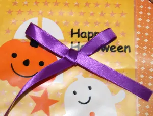 Purple satin ribbon bow for gift wrapping, 1cm width Halloween craft ribbon detail.