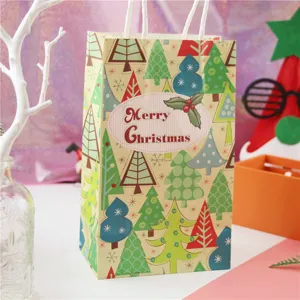 Christmas paper gift bag with festive tree patterns and handle for holiday party present packing.