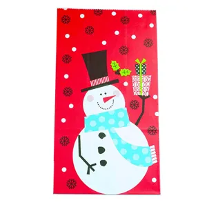 Christmas gift paper bag with cute snowman design red background holiday party packaging wrap