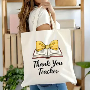 Detailansicht der weißen Canvas Tragetasche mit Lehrer Dankeschön Motiv und gelber Schleife.