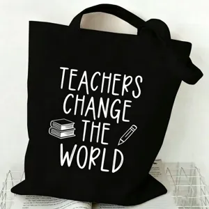 Close-up detail of the black canvas tote bag featuring white teacher theme print and durable fabric.
