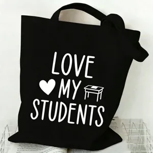 Simple black canvas tote bag with teacher theme letter print, large capacity daily shopping bag.