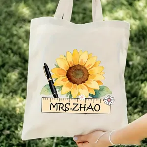 Detalle de bolsa de lona de profesor de girasol personalizada, con texto personalizado y arte floral.