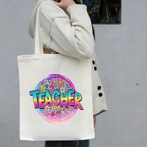 Detailopname van de canvas linnen tas voor leraren met grafische opdruk en schouderdraagstijl.