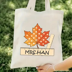 Bolsa tote de lona para profesor con estampado de hoja de arce y regla para uso diario.