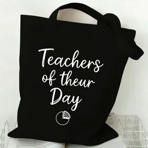 Black canvas tote bag detail, featuring custom teacher theme print, minimalist design.