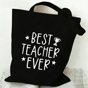 Black canvas tote bag detail showing the white best teacher ever print and sturdy handle design.