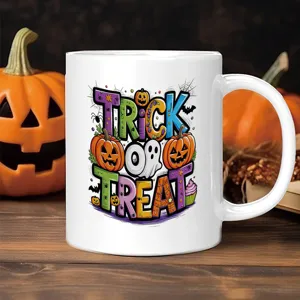 Halloween ceramic coffee mug detail, festive trick or treat pumpkin ghost design for party decor.