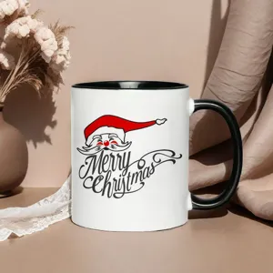 White ceramic coffee mug with black handle and Merry Christmas Santa Claus graphic design.