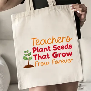 Nahaufnahme Detail der Lehrertasche aus Leinen mit inspirierendem Zitat und süßem Pflanzenmotiv.
