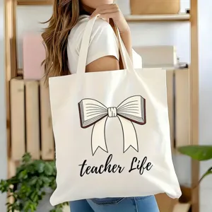 Detailansicht der praktischen Segeltuchtasche mit Buchschleife und Aufschrift.