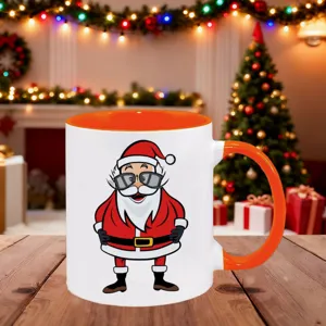 Christmas ceramic coffee mug with cool Santa print, orange handle and inner wall.
