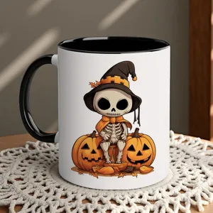 Ceramic coffee mug detail showing cute Halloween skeleton with pumpkin and witch hat design.