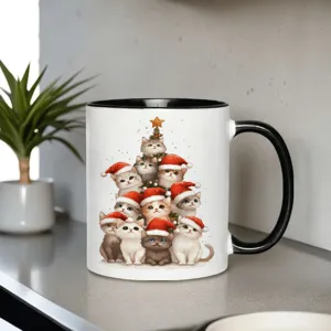 Christmas cat ceramic coffee mug with cute Santa kittens and tree design detail view.
