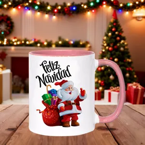 Christmas themed ceramic coffee mug with pink handle and cute Santa Claus graphic design