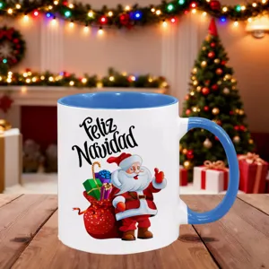 Close-up detail of festive Christmas ceramic mug with blue handle and cute Santa design.