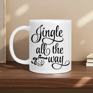 Detailed view of white ceramic coffee mug with Christmas Jingle text on wooden desk mockup.