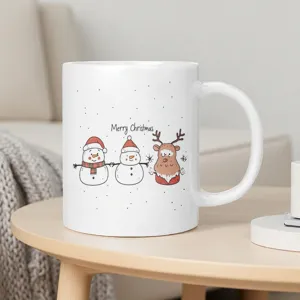 Cute Christmas ceramic coffee mug featuring snowman and reindeer illustrations for holiday gifts.