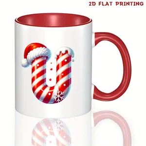 Taza de cafe de ceramica de Navidad con diseno de letra U de baston de caramelo, rojo.