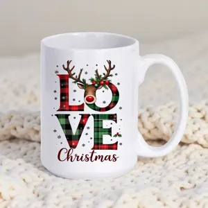 Close-up view of a white ceramic coffee mug featuring festive Christmas plaid and reindeer.
