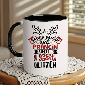Detail view of Christmas reindeer ceramic coffee mug with black rim and handle for hot drinks.