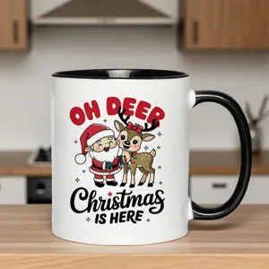 Christmas ceramic coffee mug with cute Santa and reindeer print, black handle and rim.