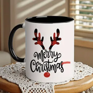 Christmas ceramic coffee mug with black handle and red plaid reindeer antlers design for holiday decor.