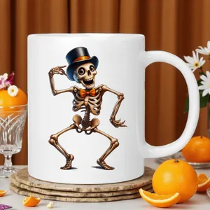 Closeup detail of a white ceramic coffee mug featuring a fun dancing skeleton print.