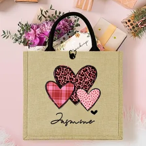 Personalized burlap tote bag with charming heart design and custom name for gifts.
