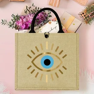 Aesthetic evil eye jute tote bag with large capacity, perfect for beach picnics and daily shopping.