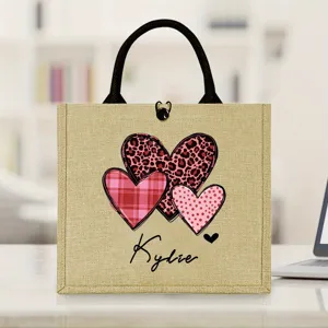 Custom jute tote bag detail featuring heart prints and personalized Kylie name design.