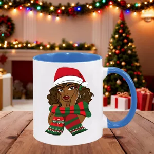 Detailed view of Christmas themed ceramic mug showcasing cute holiday art and blue handle.
