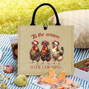 Detail view of the Christmas chicken burlap tote bag, showing festive rooster print clearly.