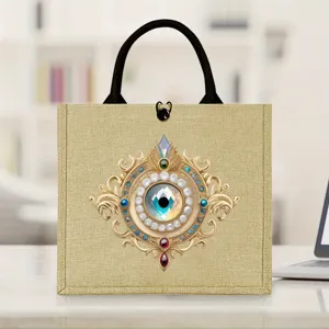 Mysterious eye jute tote bag with evil eye print, stylish durable eco handbag for daily use.