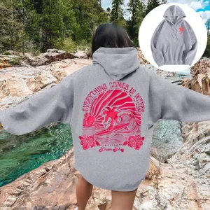 Sweat-shirt a capuche gris oversized pour femme avec imprime surf et epaules tombees.