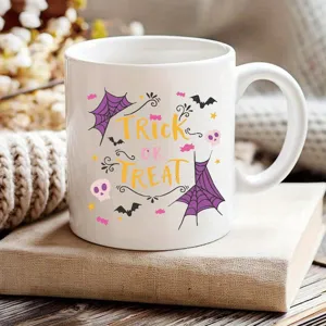 Halloween ceramic coffee mug with trick or treat design, cute office and home drinkware.