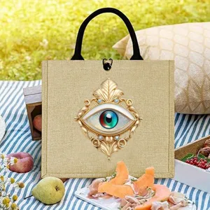 Mystic evil eye print burlap tote bag, aesthetic vintage canvas handbag for casual use.