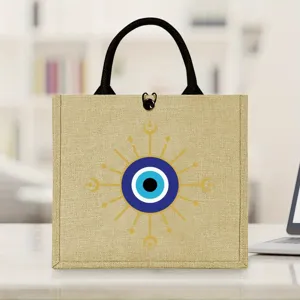 Evil eye burlap tote bag with sturdy black handles, ideal for daily shopping, travel and picnics.
