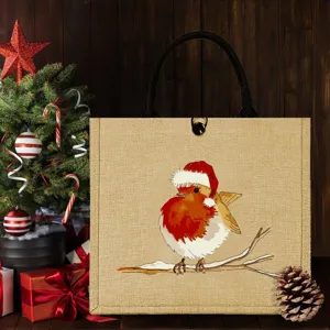 Vue détaillée du sac cabas en jute avec imprimé rouge-gorge de Noël, décor de fête chaleureux.