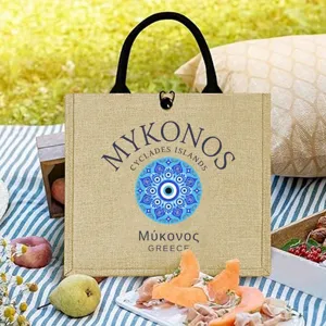 Detailed view of the stylish Mykonos evil eye jute tote bag showcasing vibrant blue mandala print.
