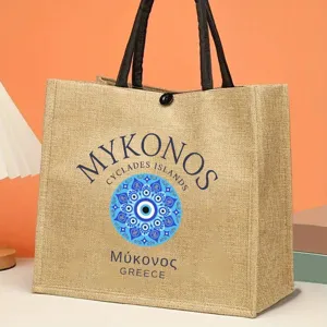 Stylish jute tote bag with Mykonos evil eye print, perfect everyday canvas handbag.