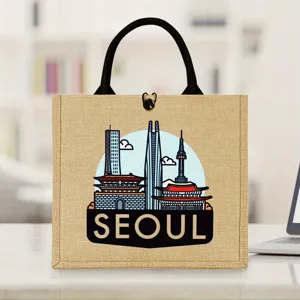Vue de détail du sac cabas en jute Seoul durable avec impression de silhouette urbaine et anses.