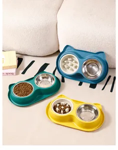 Vue detaillee des gamelles doubles pour animaux avec mangeoire lente et insert en acier inoxydable.