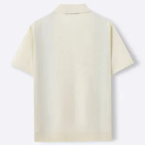 Back view detail of men's short-sleeve knit polo shirt in off-white with ribbed hem.