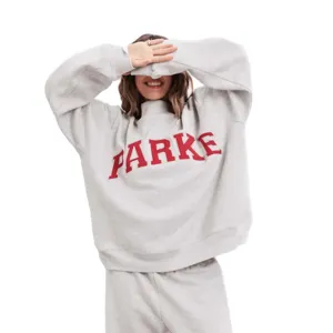 Comfortable grey sweatshirt and sweatpants set featuring red letter print. Casual wear.