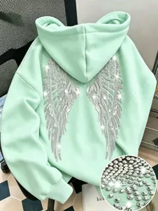 Detailed view of the mint green rhinestone angel wings hoodie, unisex casual streetwear.