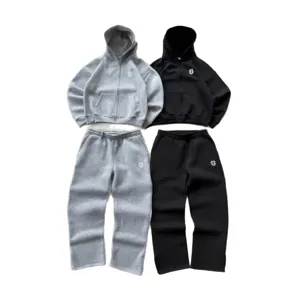 Unisex streetwear zip-up hoodie and sweatpants set in grey and black with stylish embroidery.