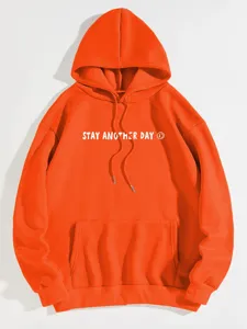 Orange fleece hoodie detail featuring front kangaroo pocket and graphic print text.