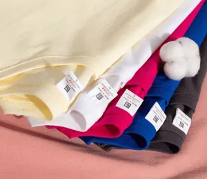 Detail view showing stacked multi-color cotton t-shirts with clear collar labels.