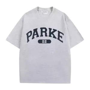 Close-up detail of grey cotton t-shirt featuring curved front print and collar size tag.